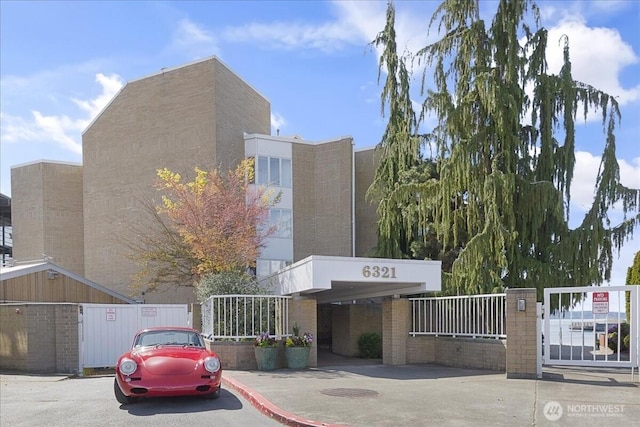 view of building exterior with fence