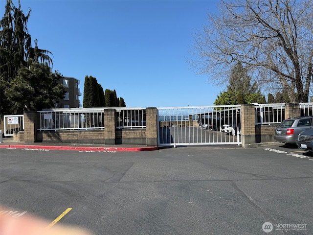 view of gate featuring fence