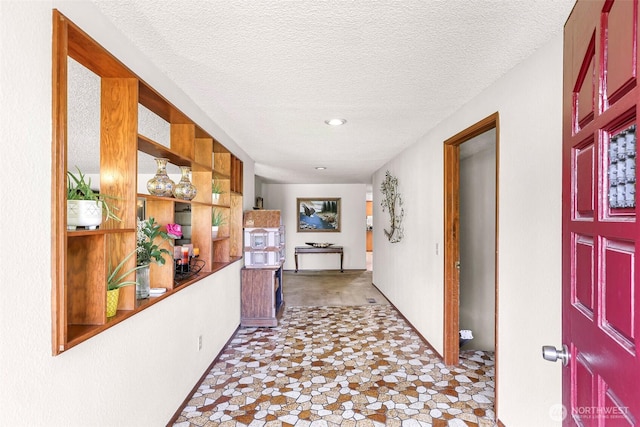 9652 Ronald Dr, Blaine, WA 98230 - hall with recessed lighting, a textured ceiling, and stone finish floor