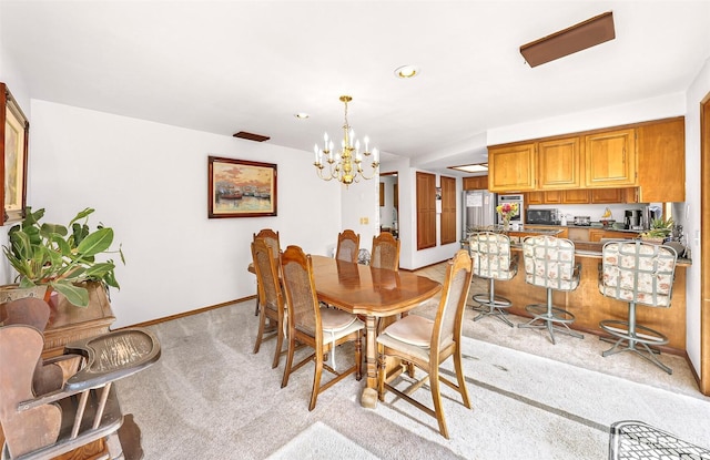 9652 Ronald Dr, Blaine, WA 98230 - dining room featuring recessed lighting, baseboards, a notable chandelier, and light carpet