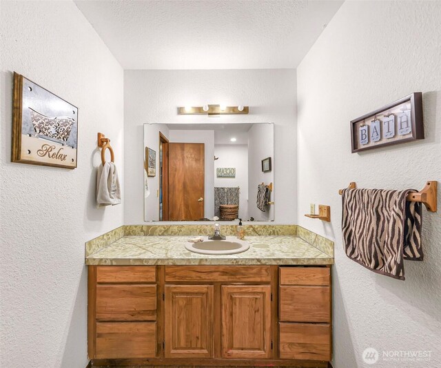 9652 Ronald Dr, Blaine, WA 98230 - bathroom with vanity and a textured wall