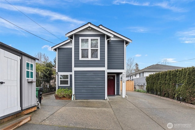 8015 Beacon Ave S Unit A, Seattle, WA 98118 - view of front of property featuring an attached garage, fence, and driveway