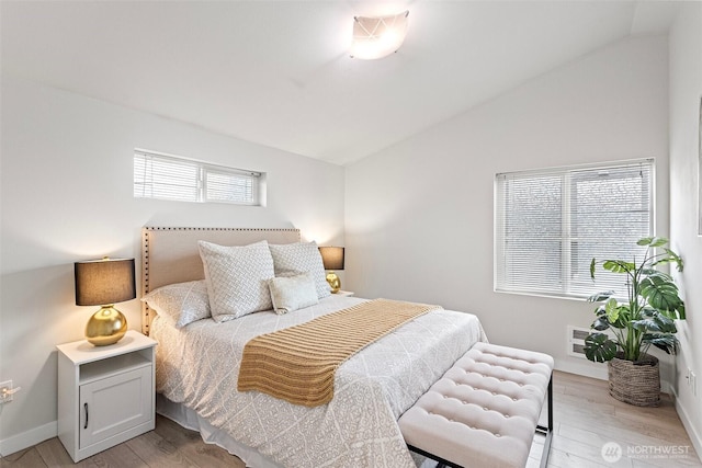 8015 Beacon Ave S Unit A, Seattle, WA 98118 - bedroom featuring light wood-style flooring, baseboards, and lofted ceiling