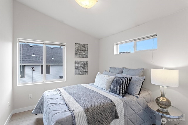 8015 Beacon Ave S Unit A, Seattle, WA 98118 - bedroom with baseboards, wood finished floors, and lofted ceiling