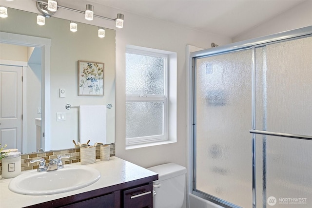 8015 Beacon Ave S Unit A, Seattle, WA 98118 - bathroom featuring tasteful backsplash, toilet, vanity, and vaulted ceiling