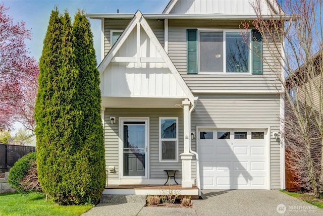 view of front of house featuring board and batten siding, an attached garage, and aphalt driveway