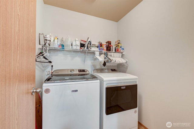 laundry area featuring washer and clothes dryer and laundry area