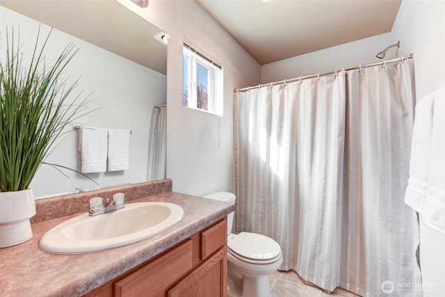 bathroom with toilet and vanity