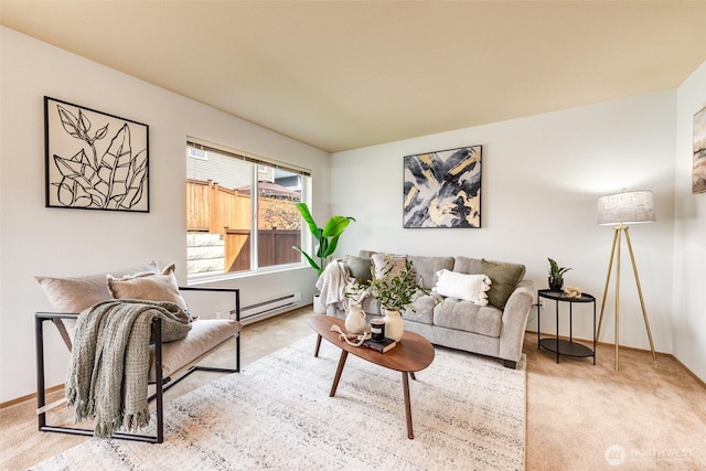 carpeted living room featuring a baseboard heating unit and baseboards