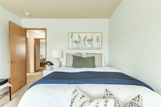 bedroom featuring light colored carpet