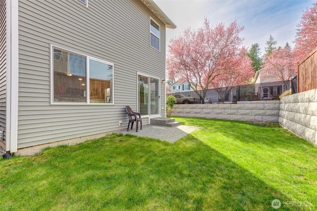 view of yard with a fenced backyard