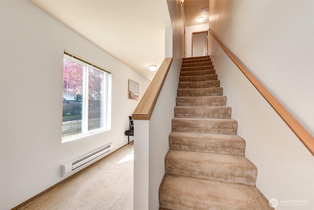 stairway featuring carpet floors and baseboard heating