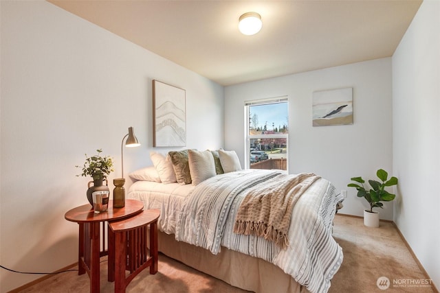 carpeted bedroom with baseboards