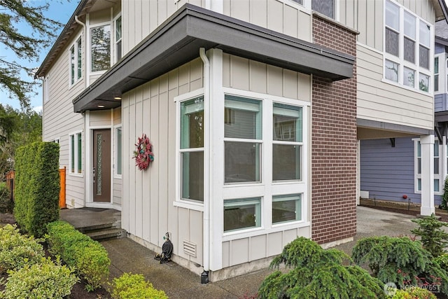 1332 247th Pl NE, Sammamish, WA 98074 - view of side of home with brick siding and board and batten siding