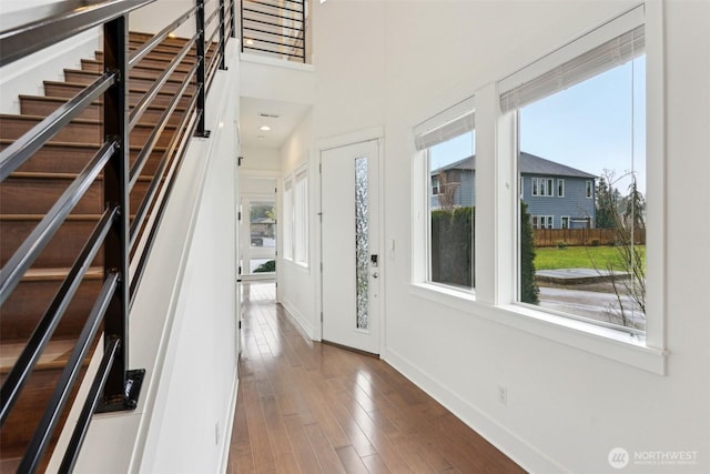 1332 247th Pl NE, Sammamish, WA 98074 - foyer entrance with stairs, baseboards, wood finished floors, and a healthy amount of sunlight