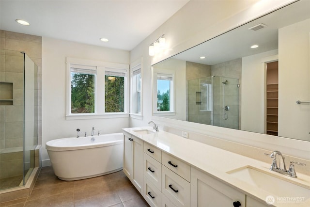 1332 247th Pl NE, Sammamish, WA 98074 - bathroom with a shower stall, tile patterned flooring, double vanity, and a sink