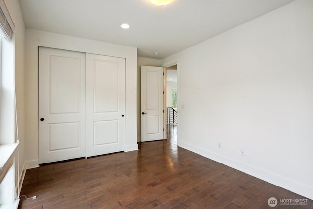 1332 247th Pl NE, Sammamish, WA 98074 - unfurnished bedroom with recessed lighting, a closet, baseboards, and dark wood finished floors