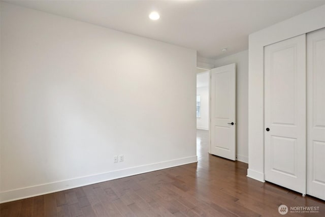 1332 247th Pl NE, Sammamish, WA 98074 - unfurnished bedroom with a closet, recessed lighting, dark wood-style flooring, and baseboards