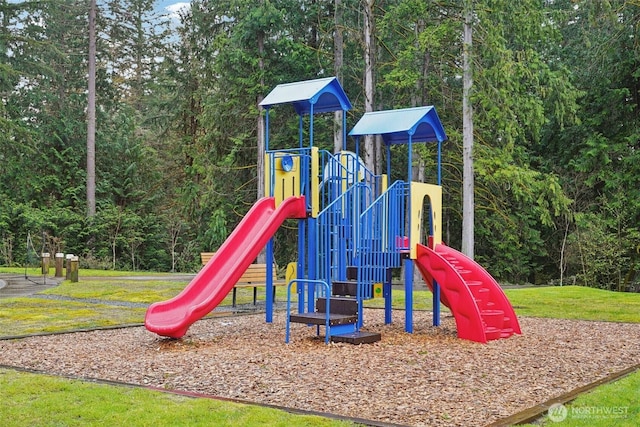 1332 247th Pl NE, Sammamish, WA 98074 - community jungle gym featuring a wooded view and a lawn