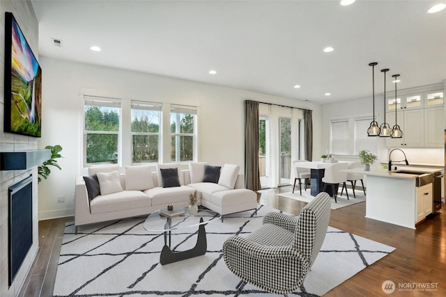 1332 247th Pl NE, Sammamish, WA 98074 - living room with a fireplace, dark wood finished floors, baseboards, and recessed lighting