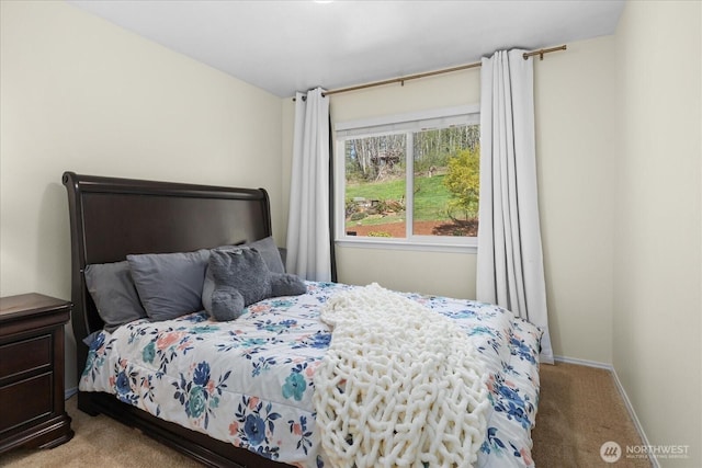 carpeted bedroom with baseboards