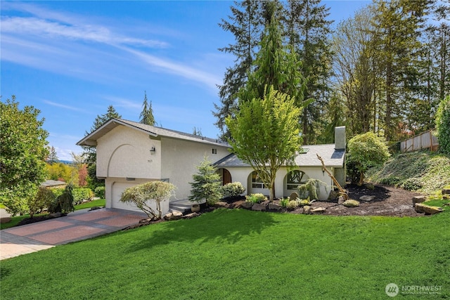 9115 SE 72nd Pl, Mercer Island, WA 98040 - view of front of property featuring an attached garage, stucco siding, decorative driveway, and a front yard