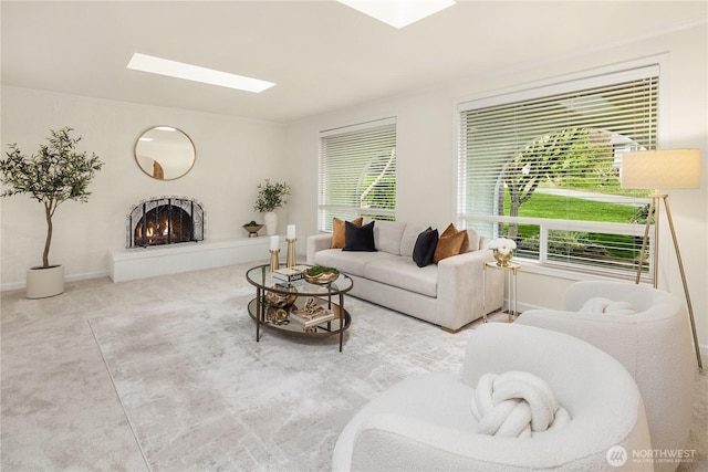 9115 SE 72nd Pl, Mercer Island, WA 98040 - living room with a warm lit fireplace, a skylight, and baseboards