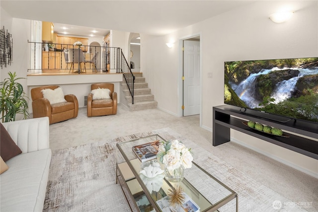 9115 SE 72nd Pl, Mercer Island, WA 98040 - living area featuring arched walkways, baseboards, carpet, and stairs