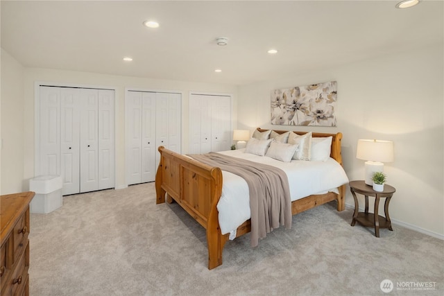 9115 SE 72nd Pl, Mercer Island, WA 98040 - bedroom featuring light carpet, recessed lighting, baseboards, and multiple closets