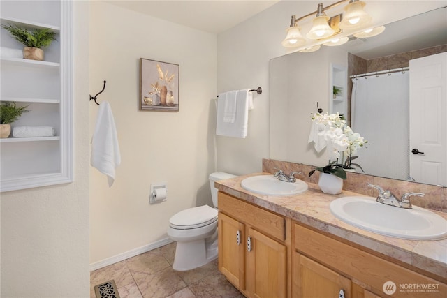 9115 SE 72nd Pl, Mercer Island, WA 98040 - bathroom featuring double vanity, visible vents, a sink, and toilet