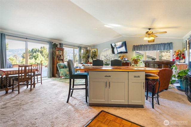 69 N Pt, Bellingham, WA 98229 - kitchen featuring a center island, a ceiling fan, wooden counters, a kitchen bar, and lofted ceiling
