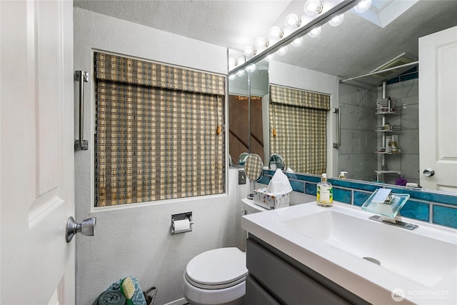 69 N Pt, Bellingham, WA 98229 - full bath featuring a textured ceiling, vanity, toilet, a shower, and a textured wall