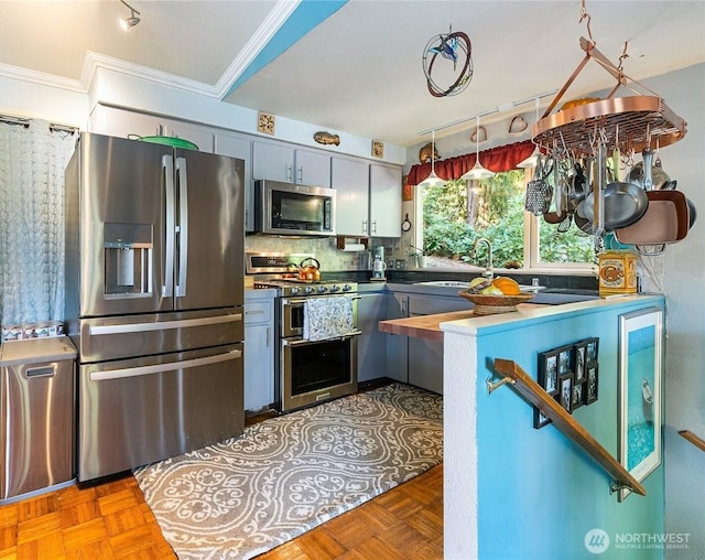 69 N Pt, Bellingham, WA 98229 - kitchen with tasteful backsplash, a sink, crown molding, and appliances with stainless steel finishes