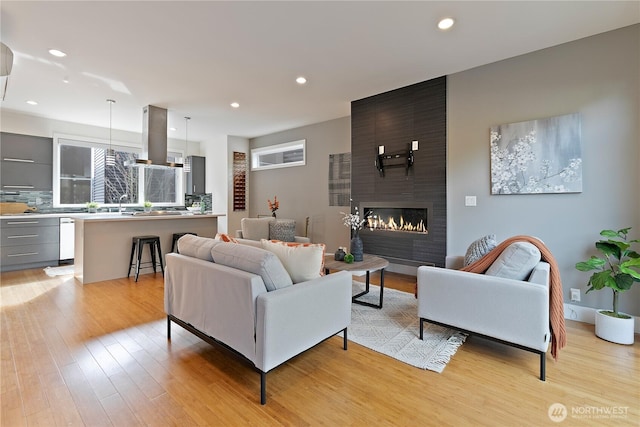 1762 Valentine Pl S, Seattle, WA 98144 - living room featuring light wood-type flooring, recessed lighting, and a fireplace