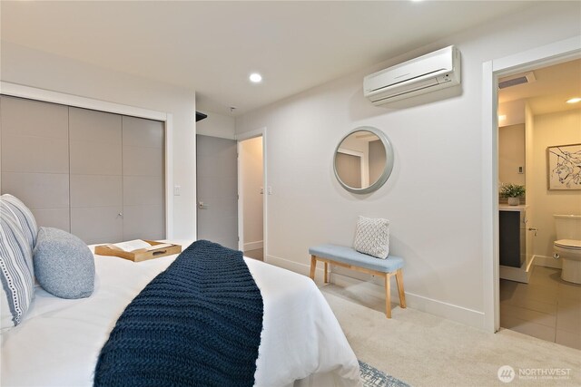 1762 Valentine Pl S, Seattle, WA 98144 - carpeted bedroom featuring a wall mounted AC, baseboards, recessed lighting, ensuite bathroom, and visible vents