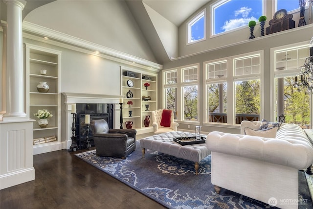 2001 Stillwater Dr, Walla Walla, WA 99362 - living area with built in features, decorative columns, a fireplace, wood finished floors, and high vaulted ceiling