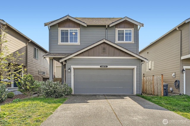 traditional-style house with a garage, fence, board and batten siding, and driveway