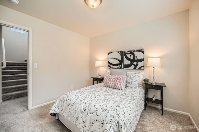 carpeted bedroom with baseboards