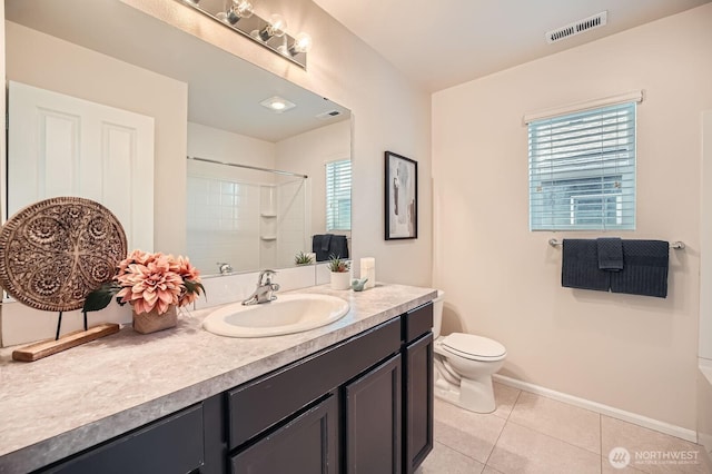 full bathroom featuring visible vents, toilet, plenty of natural light, tile patterned floors, and a tile shower