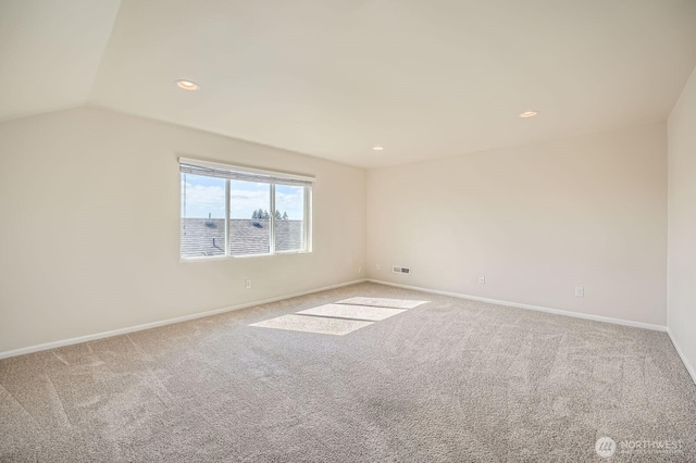 carpeted spare room with baseboards, recessed lighting, and lofted ceiling