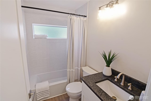 bathroom with toilet, vanity, wood finished floors, and shower / bath combo with shower curtain