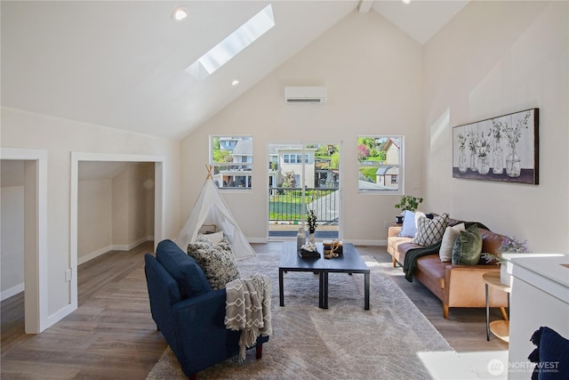 living area with a wall mounted air conditioner, high vaulted ceiling, wood finished floors, a skylight, and baseboards