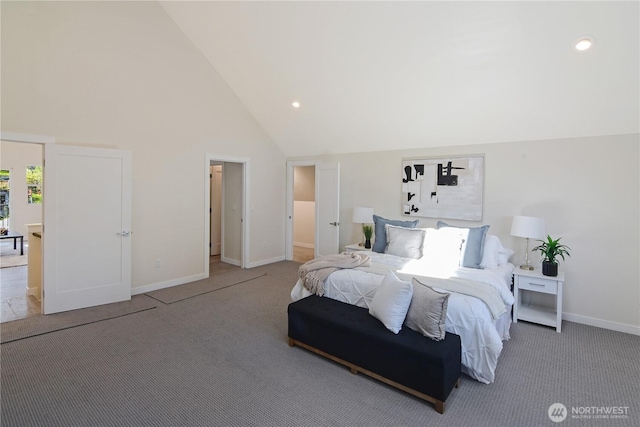bedroom featuring carpet, baseboards, and high vaulted ceiling