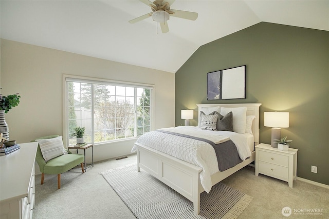 bedroom with ceiling fan, light colored carpet, visible vents, lofted ceiling, and baseboards
