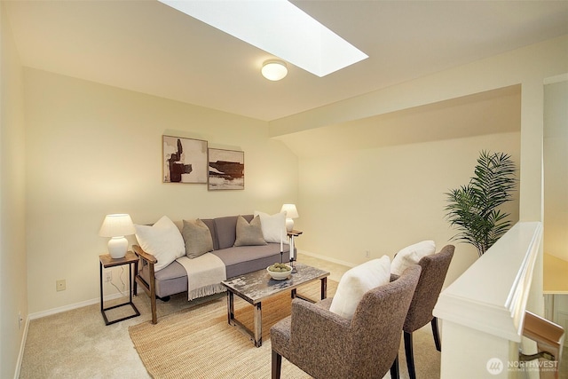 living area with light carpet, baseboards, and lofted ceiling with skylight