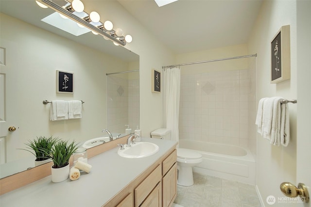 full bath with shower / bathtub combination with curtain, vanity, toilet, and a skylight