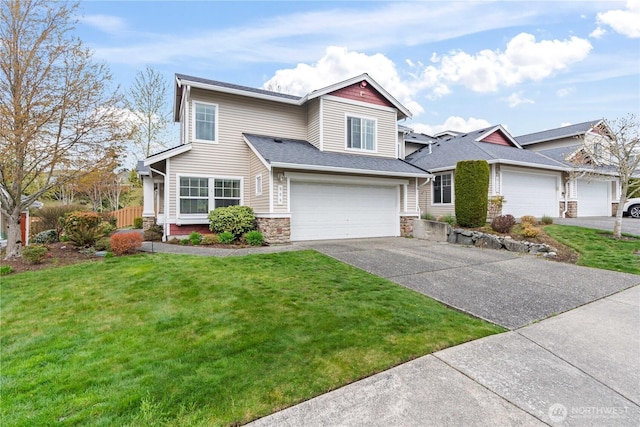 view of front facade featuring driveway, stone siding, an attached garage, a front lawn, and fence