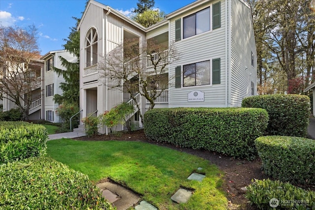 view of property with a front lawn