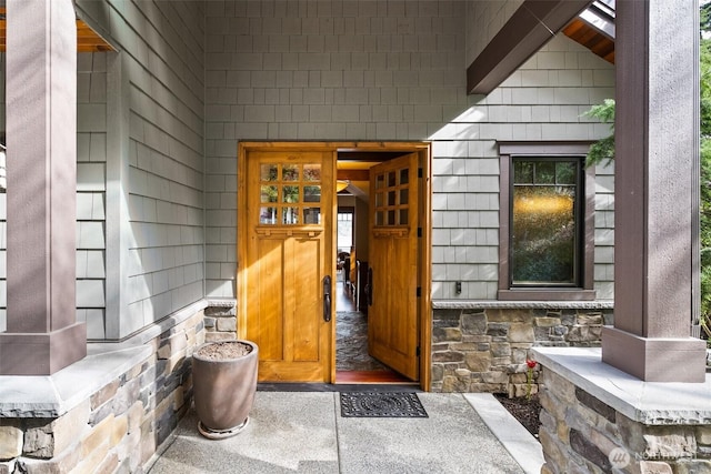 view of exterior entry with stone siding