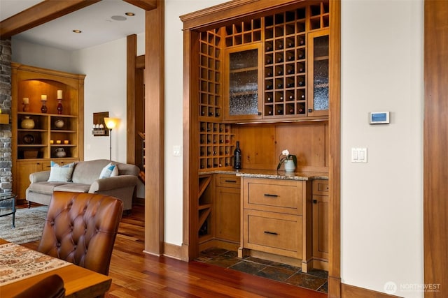 wine area with dark wood finished floors